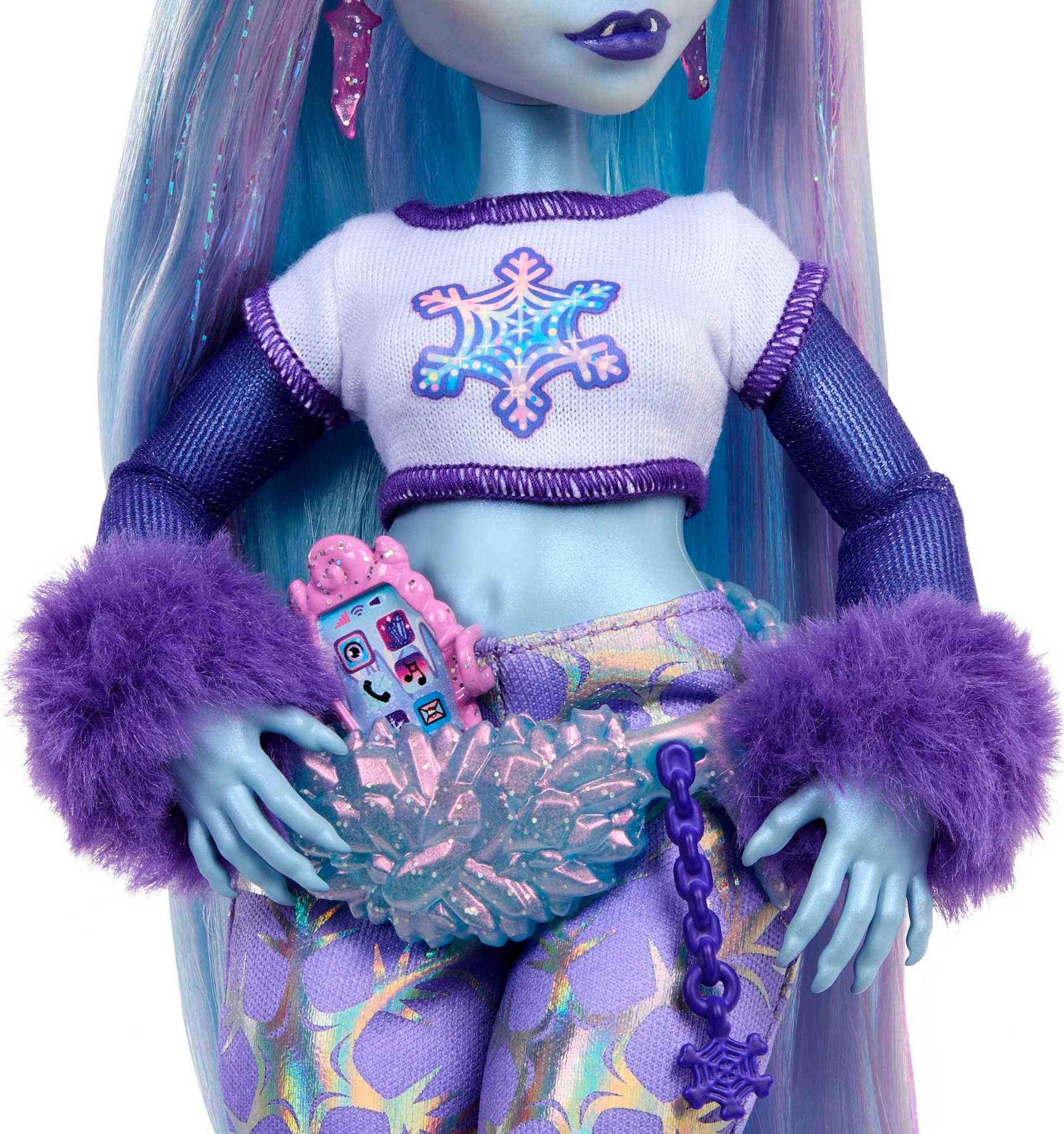 Trendy blue-skinned doll with pastel hair, snowflake top, stylish pants, and accessories.