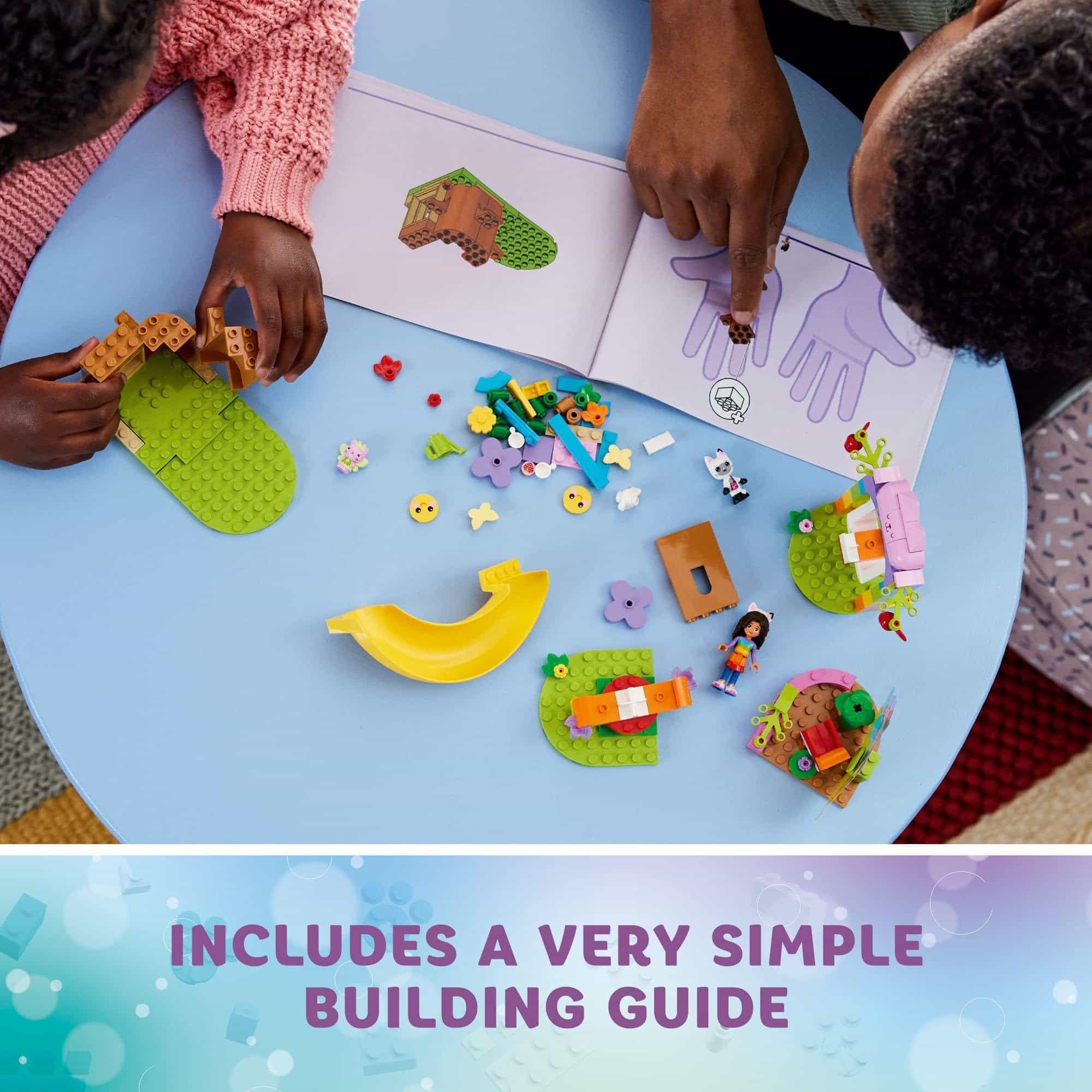 Hands building a colorful playset, fostering creativity and teamwork with a simple guide nearby.
