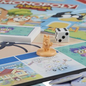 Vibrant Monopoly Junior game board with colorful characters and playful neighborhood design for kids.