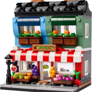 Whimsical two-story LEGO fruit shop with vibrant colors, awning, fruit displays, and charming balconies.