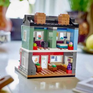 Colorful LEGO house with cozy two-story design and inviting interior details for imaginative play.