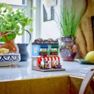 Charming miniature retail shop brings warmth and creativity to a cozy kitchen scene.