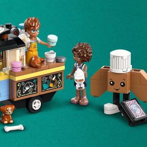 Joyful LEGO scene with food truck, characters sharing drinks, and a playful dog.