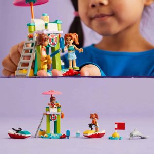 Colorful beach playset with lifeguard tower, featuring a child and vibrant accessories for imaginative play.