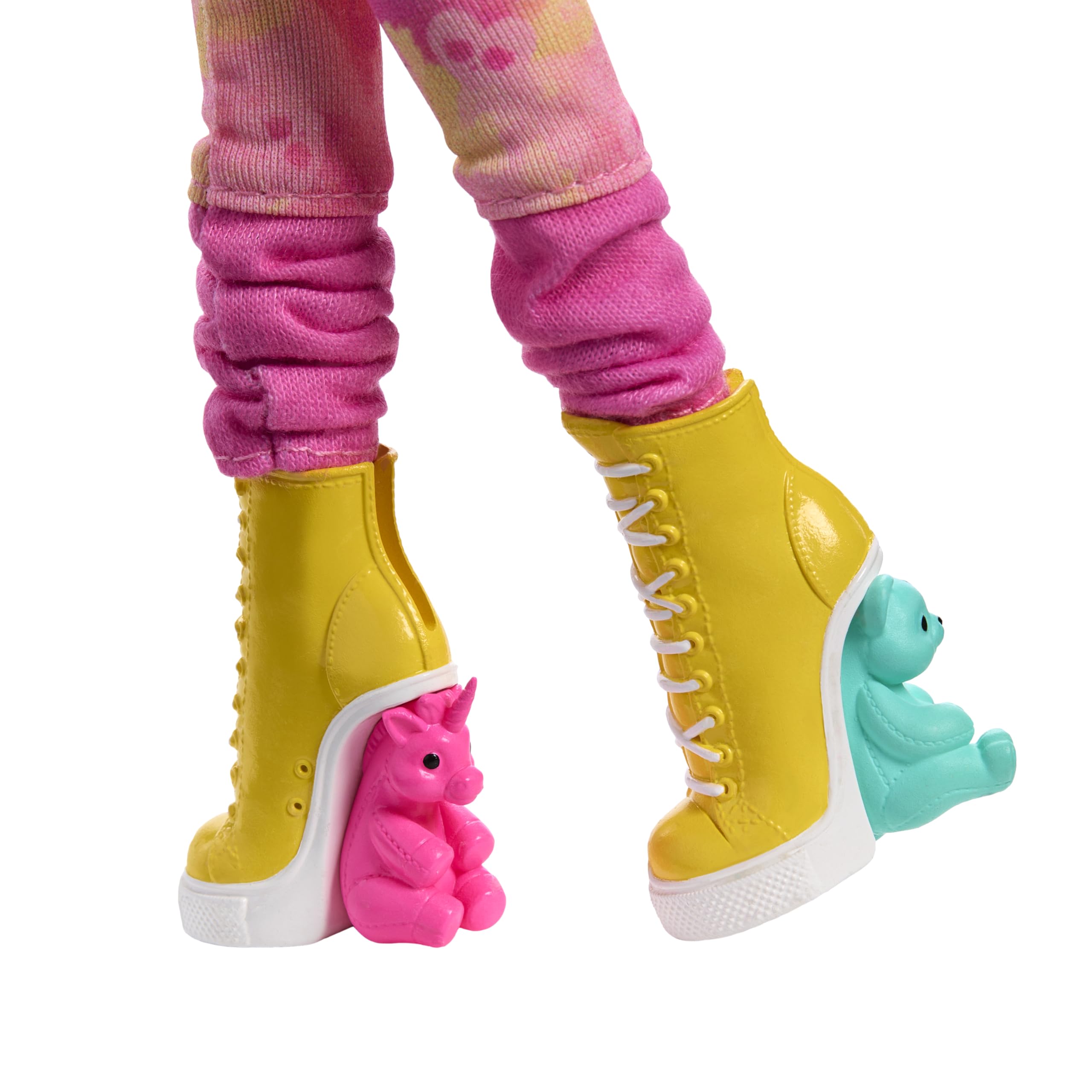 Whimsical yellow high-heeled boots with playful bear accents and pink textured leggings.
