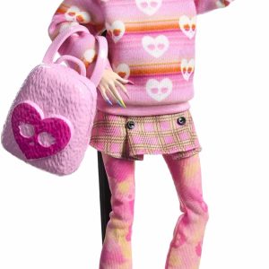 Trendy fashion doll in playful pink outfit, chic accessories, and vibrant yellow boots.