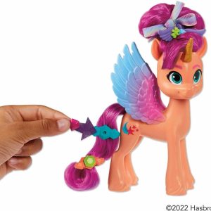 Colorful coral-pink pony toy with blue wings, unicorn horn, and customizable hair accessories for imaginative play.