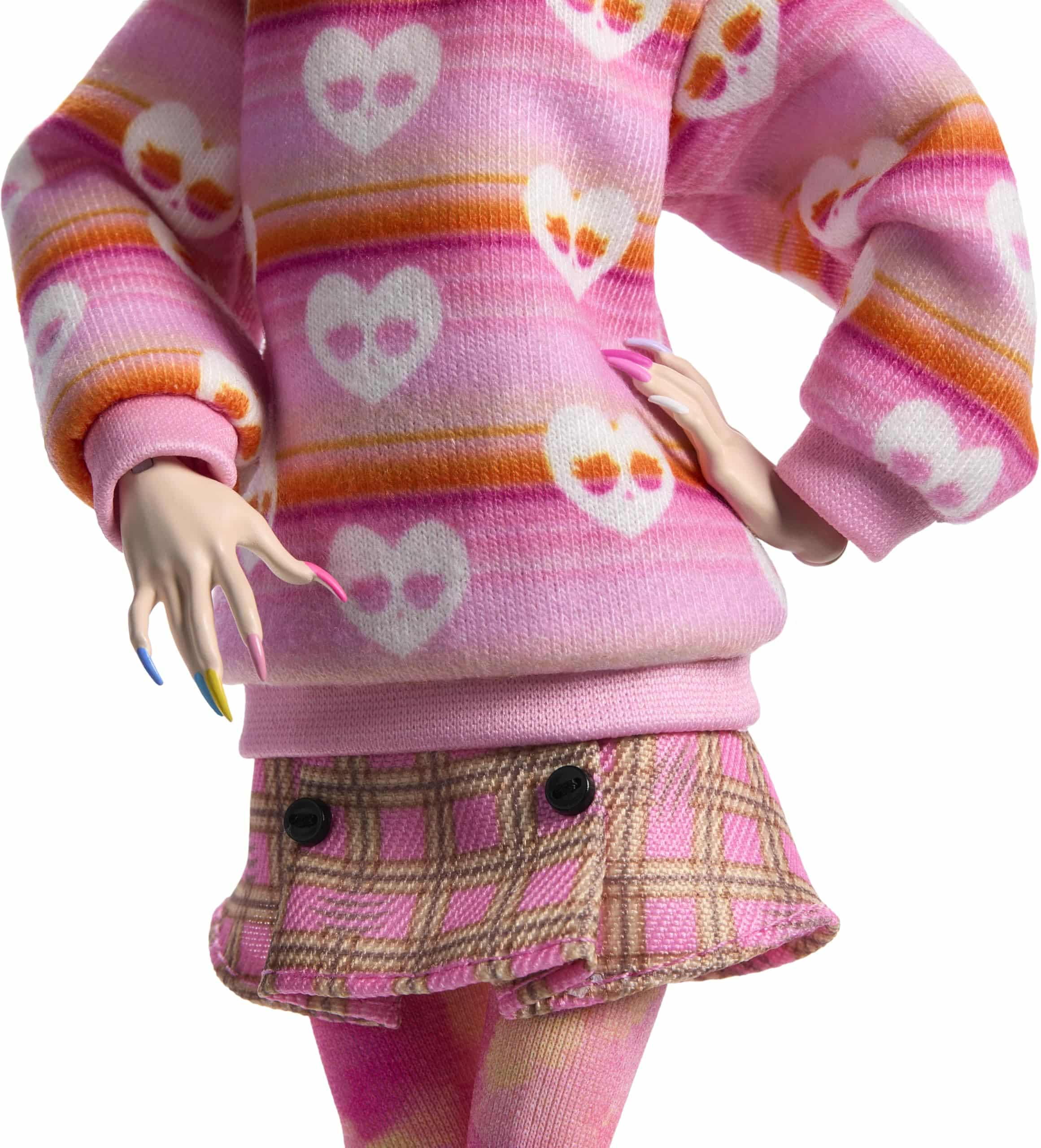 Trendy doll outfit: pink heart sweater and plaid mini skirt exuding playful charm.