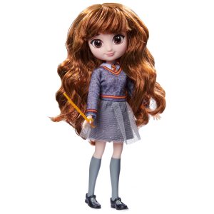 Charming doll in trendy outfit, holding magical wand for imaginative play and creativity.
