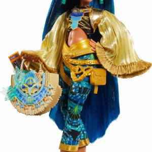 Regal blue-haired doll in elegant Egyptian-inspired fashion with golden cape and exquisite accessories.