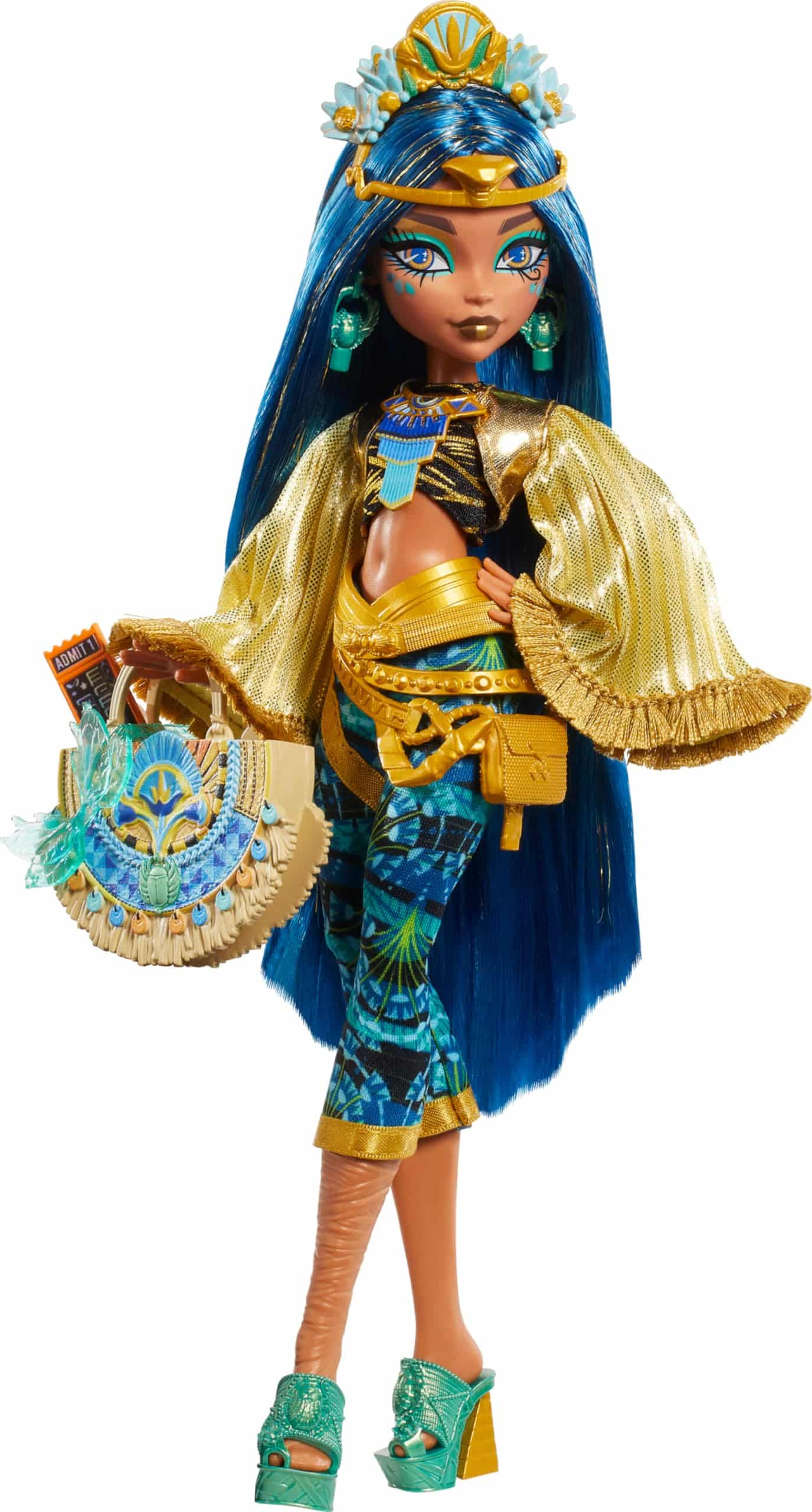 Regal blue-haired doll in elegant Egyptian-inspired fashion with golden cape and exquisite accessories.
