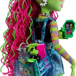 Trendy green-skin doll with pink braids, stylish outfit, and fun accessories in a clear backpack.