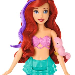 Vibrant mermaid doll with red hair, colorful outfit, and playful seahorse accessory.