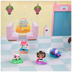 Colorful miniature playset with charming characters and a toy vehicle for imaginative adventures.