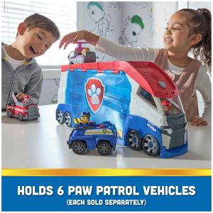 Children enjoying imaginative play with a colorful Paw Patrol toy truck in a sunny playroom.