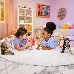 Two girls joyfully playing with colorful dolls in a bright, cheerful childrens room.