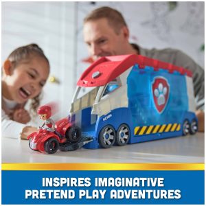 Joyful imaginative play with a vibrant rescue truck brings kids and parents together indoors.