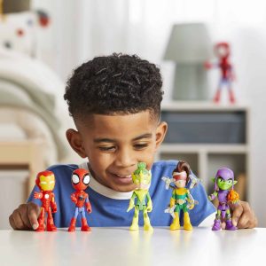 Young boy happily plays with superhero action figures in a bright, cheerful playroom.