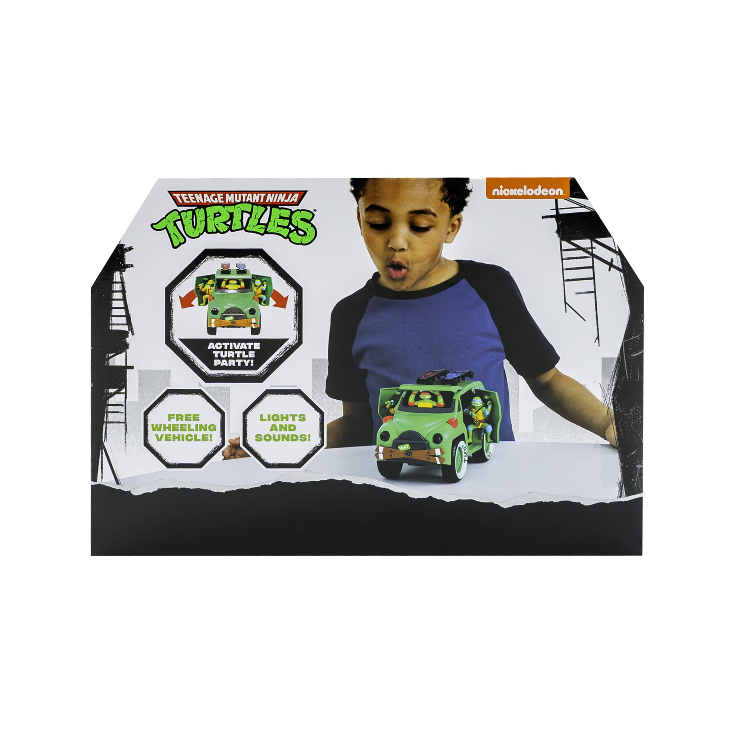 Boy joyfully interacts with a vibrant Teenage Mutant Ninja Turtles toy vehicle, inspiring imaginative play.