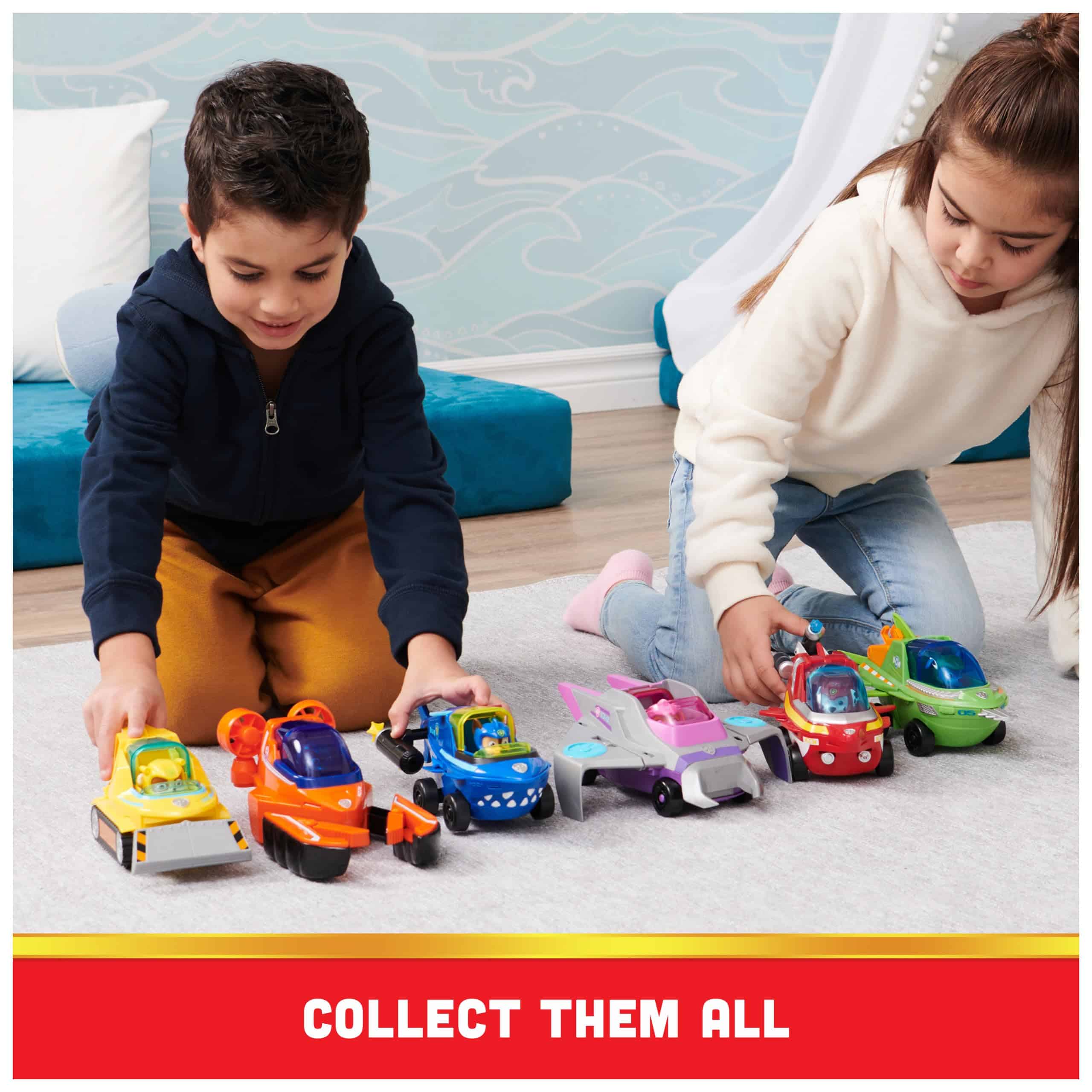 Children joyfully play with colorful toy cars, fostering creativity and cooperation in a bright setting.