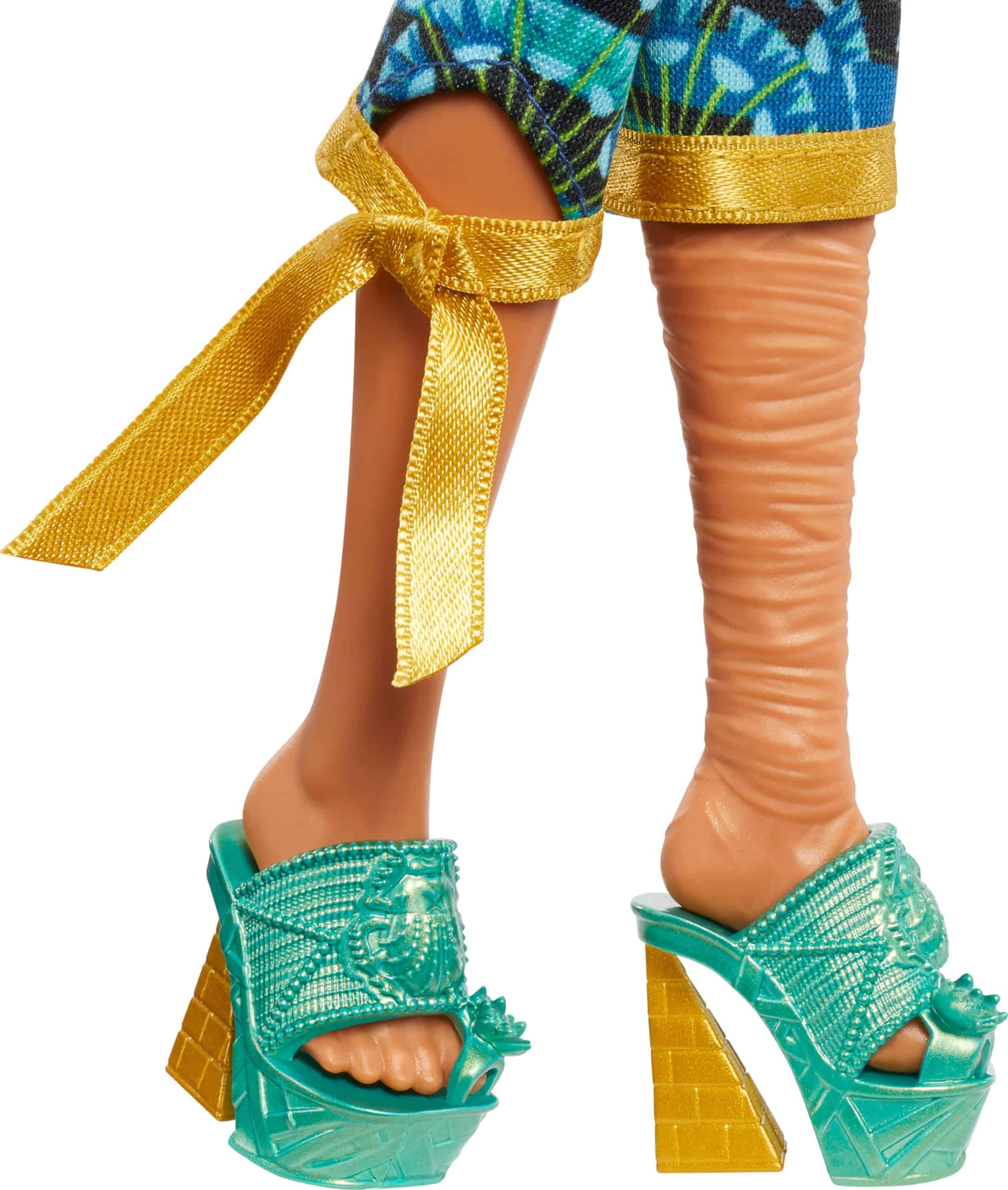 Vibrant tropical doll in chic pants and teal sandals, perfect for summer fun and style.