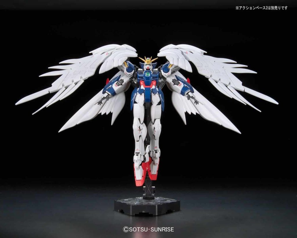 Dynamic mecha figure with blue armor and white wings, showcasing vibrant colors and intricate design.