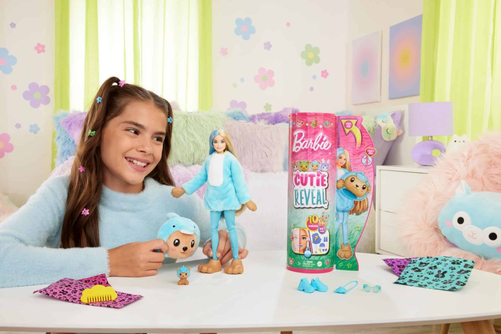 Joyful girl plays with her stylish doll in a vibrant, cozy pastel paradise.