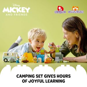Child and adult joyfully engage with Mickey camping set, fostering play and imagination together.