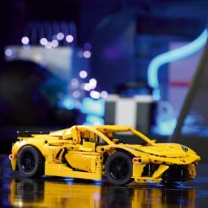 Vibrant yellow sports car model showcased with dynamic lighting and artistic detailing.