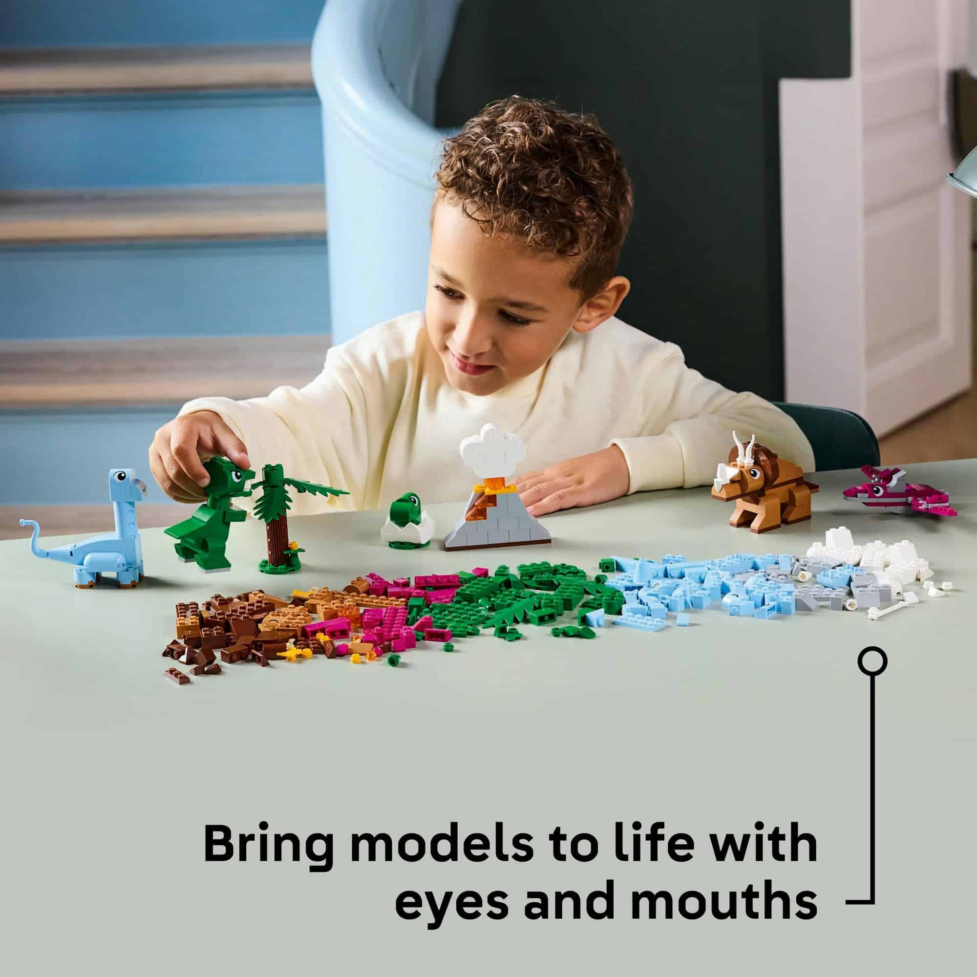 Child creatively playing with colorful building blocks, building imaginative scenes in a bright indoor space.