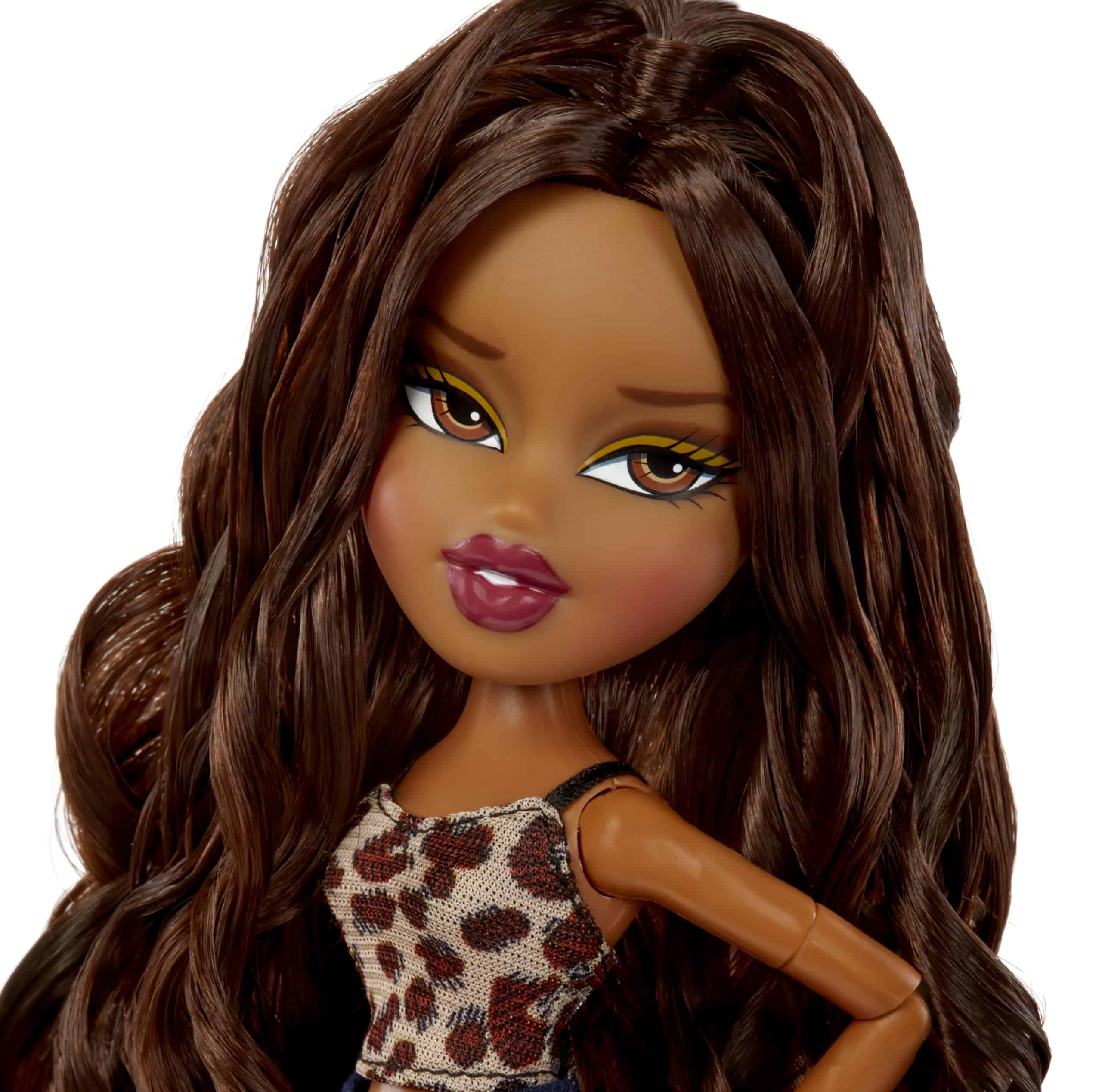 Stylish doll with leopard print top, flowing hair, and confident pose showcasing modern fashion.