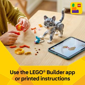 Engaging LEGO building scene features a creative person crafting a playful cat figure using technology.