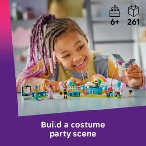 Joyful girl building a colorful Lego costume party scene full of creativity and fun.