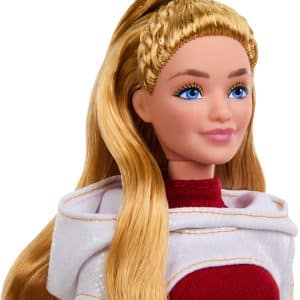 Elegant fashion doll with blue eyes, blonde waves, burgundy top, and white cape.
