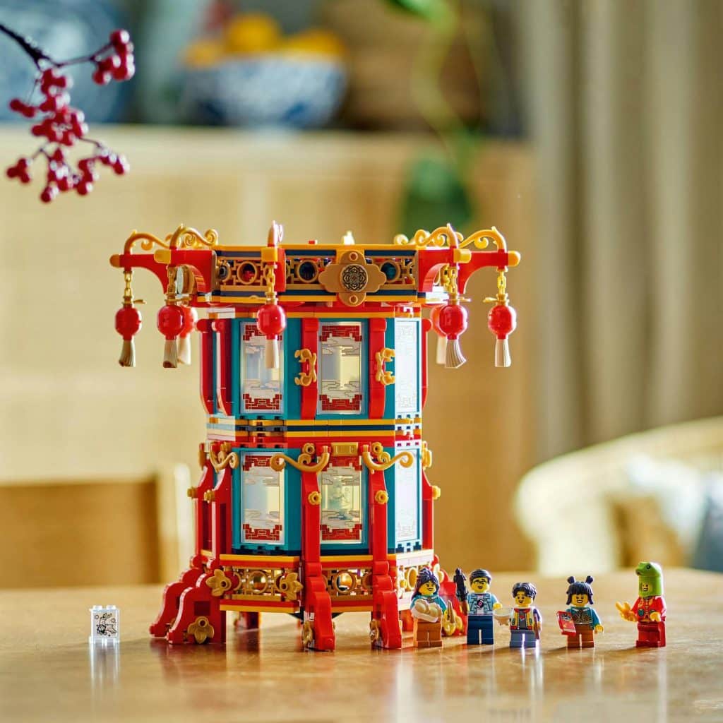 Colorful Asian pagoda with joyful figures celebrating in a cozy, warmly lit setting.