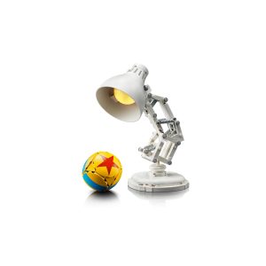 Modern lamp with warm glow beside a playful yellow beach ball.