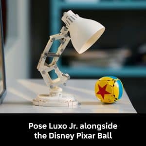 Luxo Jr. and Pixar Ball in a vibrant workspace, celebrating Pixars playful animation spirit.
