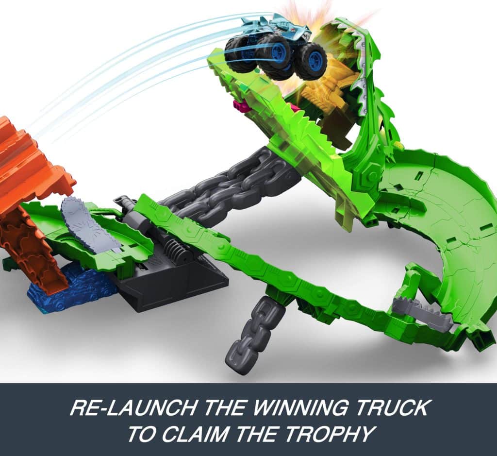 Vibrant racing playset with launch pad, trophy, and dynamic ramps for thrilling toy truck adventures.