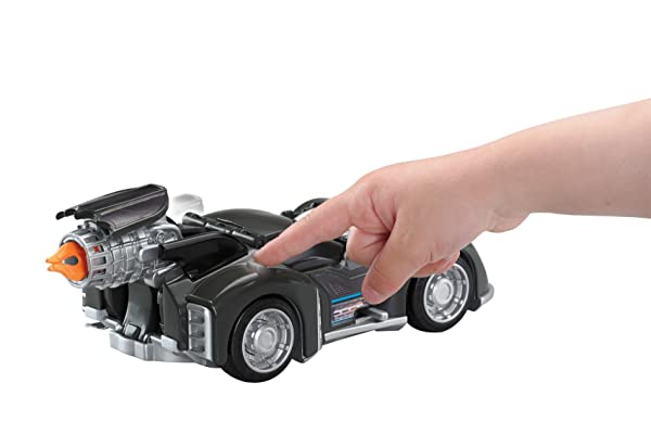 Sleek black Batman toy car sparks imaginative play as a child reaches out to engage.