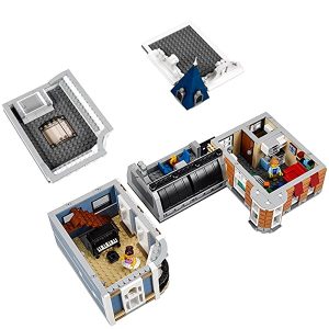 Intricate LEGO house model featuring detailed interiors, including a living room and modern kitchen.
