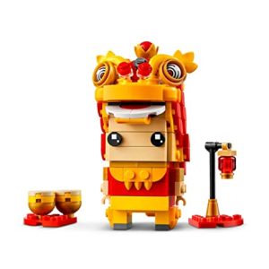 Colorful lion dance toy model celebrating cultural festivities with vibrant decorations and joyful expressions.
